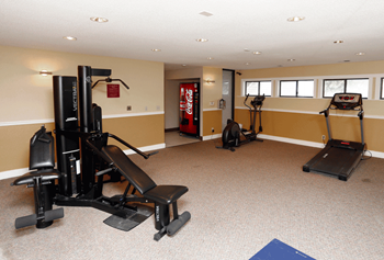 a home gym with a coke machine